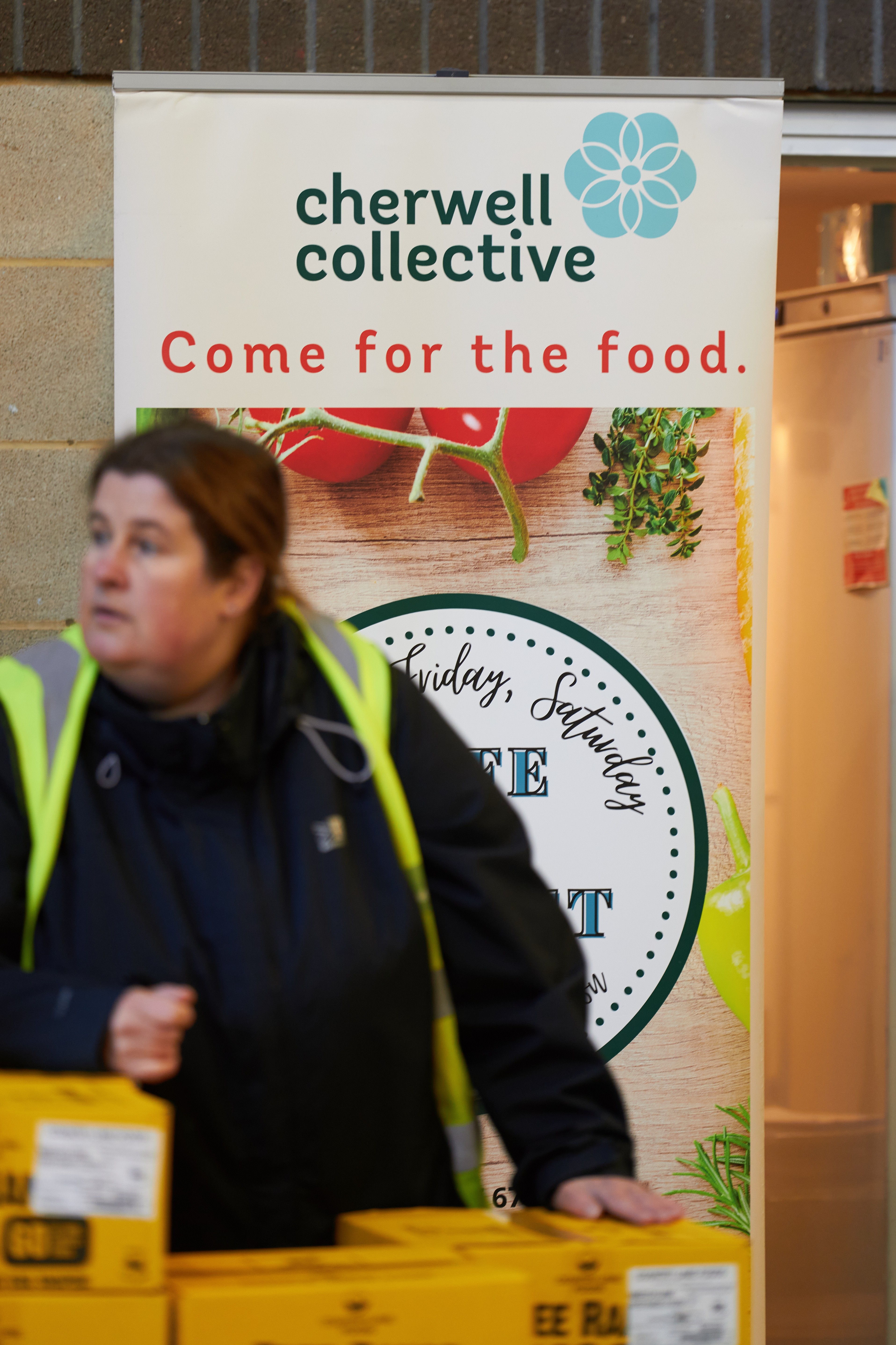 2026.  Event portrait of a woman in front of a sign that reads "Cherwell Collective"