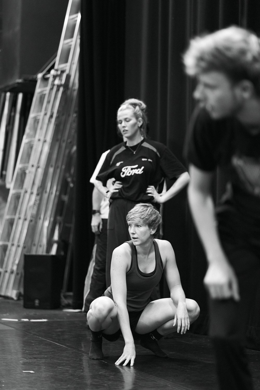 2025.  A young dancer looking on to stage