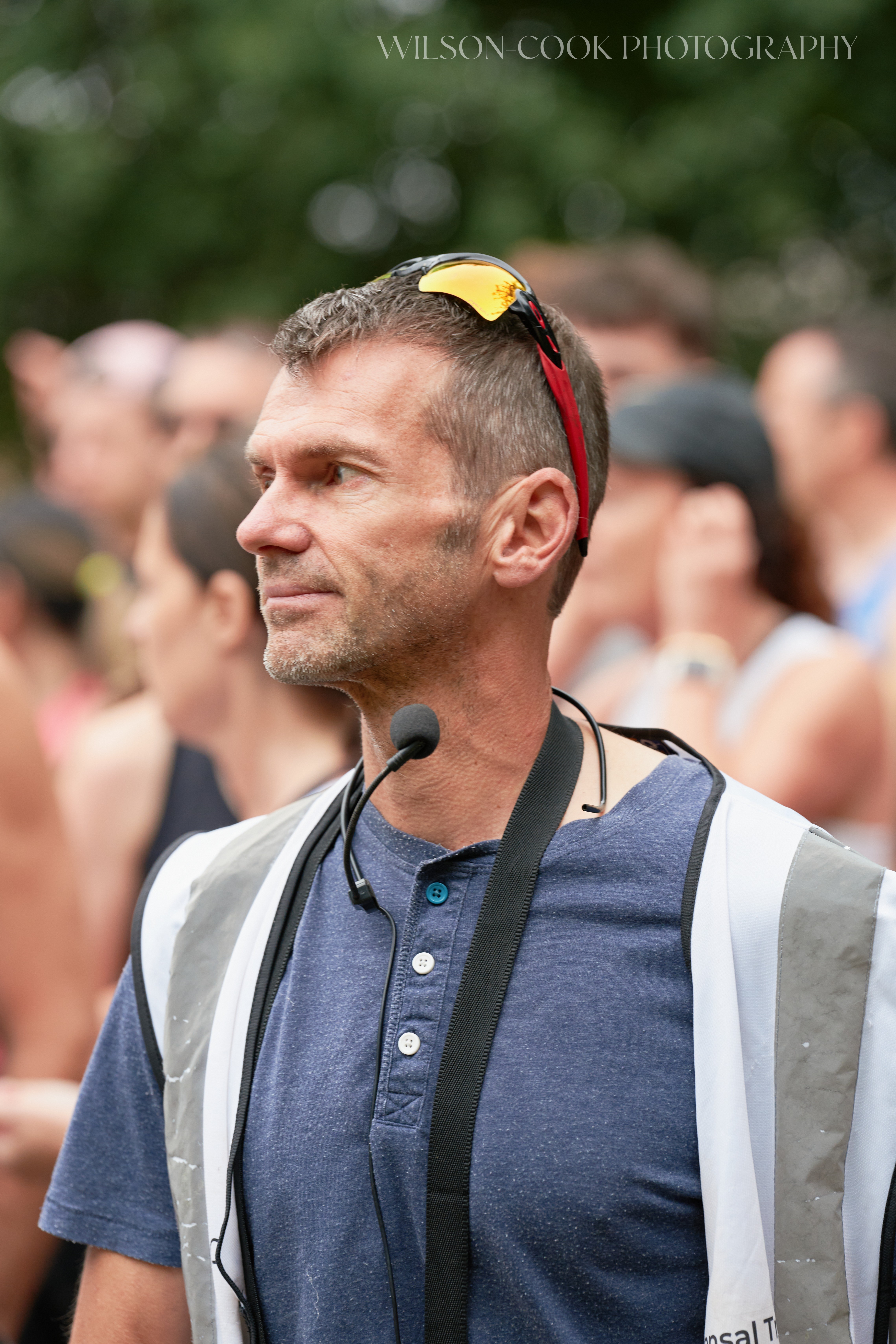 2025.  A volunteer marshal for a running event looks to the left of the frame.