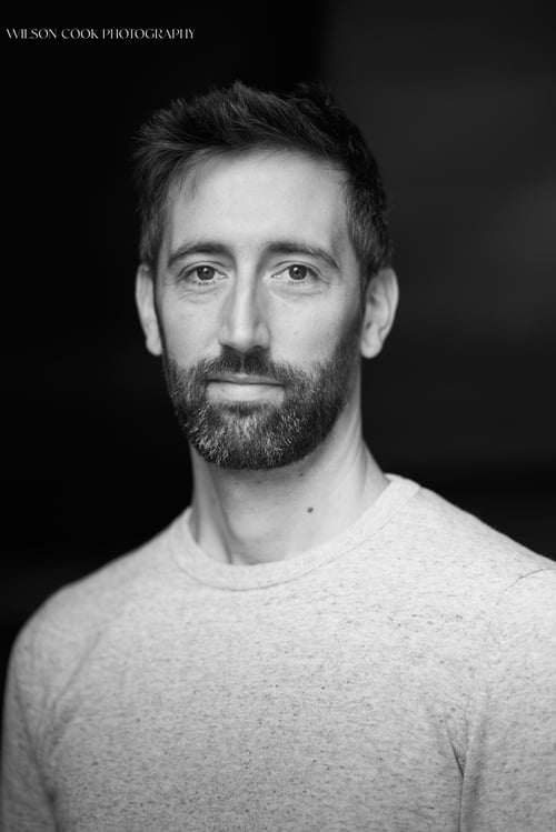 Black and white headshot of a man